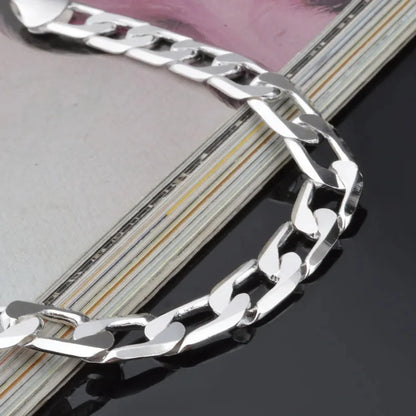 925er Silber Schweizer Figaro-Armband mit 6 bis 8 mm Zirkonia